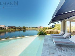 Foto 1 de Casa en Venta Puertos del Lago con vista a la laguna Barrio Los Ceibos