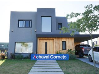Foto 3 de VENTA CON RENTA/ Casa de 3 dormitorios y dependencia en el Barrio Ceibos, Puertos.