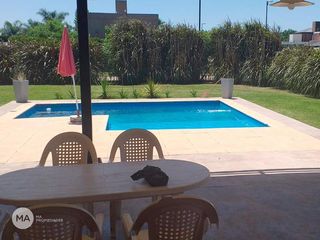 Foto 23 de Casa 3 Dormitorios Jardín y Piscina - Cantegril - Funes | Alquiler