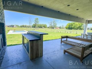 Foto 36 de Venta Casa - Barrio El Millord / Pilara - Vista a cancha de polo