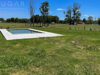 Foto 37 de Venta Casa - Barrio El Millord / Pilara - Vista a cancha de polo