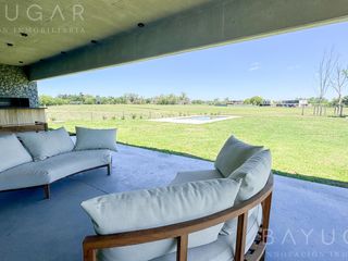 Foto 15 de Venta Casa - Barrio El Millord / Pilara - Vista a cancha de polo