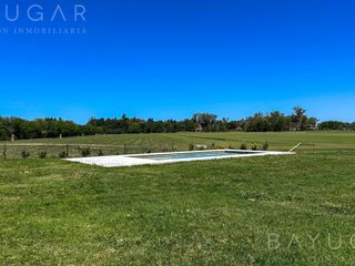 Foto 38 de Venta Casa - Barrio El Millord / Pilara - Vista a cancha de polo