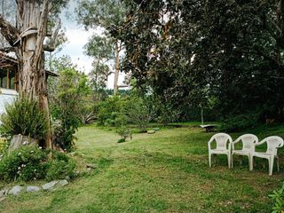 Casa en Venta de 4 habitaciones, estilo rústico, áreas verdes y árboles frutales, Sangolquí