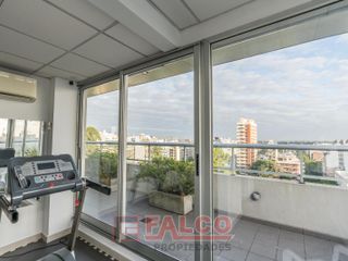 Moderno dos ambientes con balcón en edificio con Piscina, Sum y Gym
