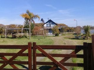 Foto 1 de HERMOSA CASA QUINTA EN VENTA CERCA DEL RIO DE LA PLATA, ACEPTA PERMUTA, AV SAN MARTIN 100 -PUNTA INDIO-